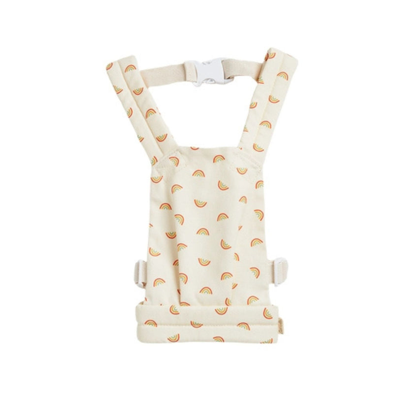 A rainbow-patterned Olli Ella Doll Carrier with padded straps designed for carrying dolls.