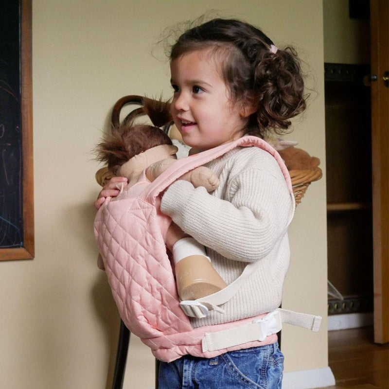 A qulited rose Olli Ella Doll Carrier with padded straps designed for carrying dolls.